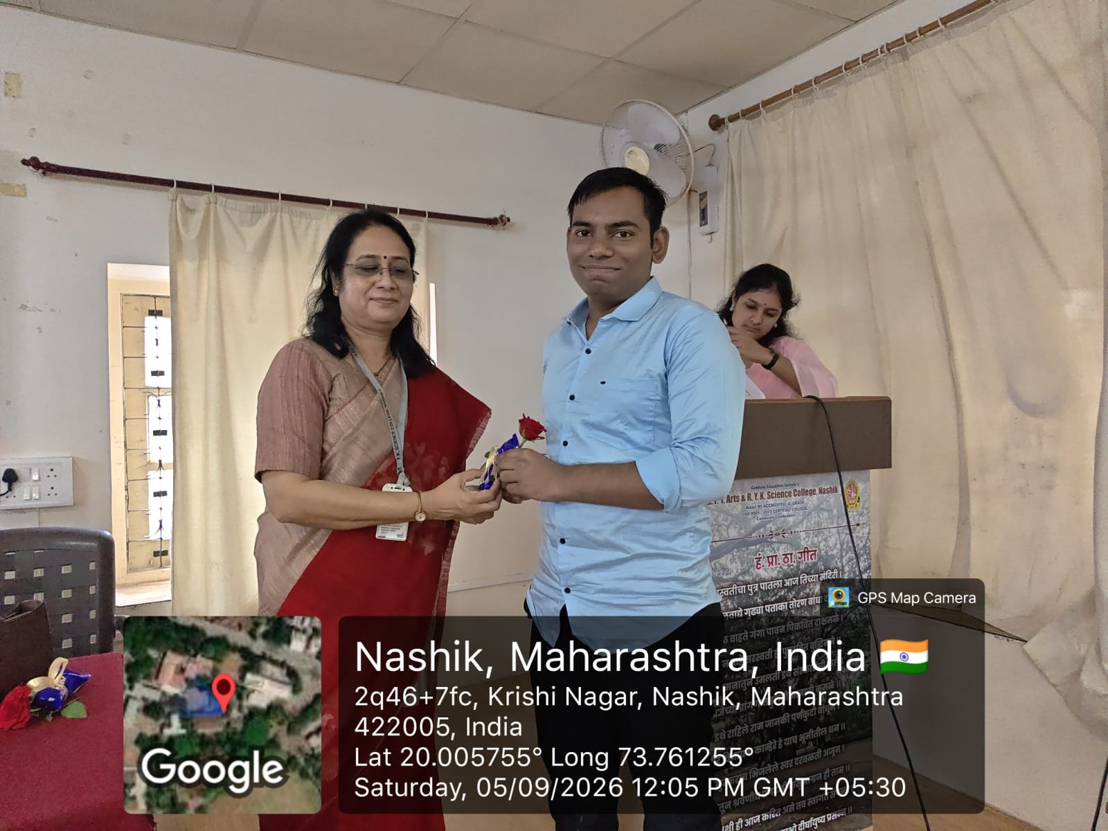 Speakers on dais during student interaction